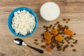 Cottage cheese in bowl, yoghurt, dried apricots and raisin, teas Royalty Free Stock Photo