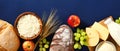 Cottage cheese, bread, wheat, apple, grape, cheese on blue background. Happy Shavuot banner design