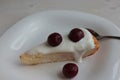 Cottage cheese casserole with cream and cherries on a plate. Royalty Free Stock Photo