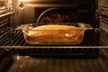 Cottage cheese casserole in a glass pan is cooked in the oven