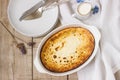 Cottage cheese casserole with raisins, served with cream, a healthy breakfast. Rustic style.