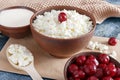 Cottage cheese on a wooden table close up Royalty Free Stock Photo