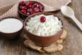 Cottage cheese on a wooden table close up Royalty Free Stock Photo