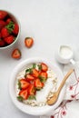 Cottage cheese, curd cheese with strawberries berries in a bowl, ogranic homemade dairy product. Healthy dairy product rich in Royalty Free Stock Photo