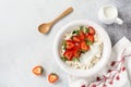 Cottage cheese, curd cheese with strawberries berries in a bowl, ogranic homemade dairy product. Healthy dairy product rich in Royalty Free Stock Photo