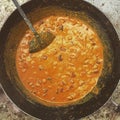 Cottage cheese curry being cooked in an Indian kitchen