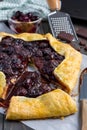 Cottage cheese dough galette with cherries and chocolate, vertical Royalty Free Stock Photo