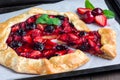 Cottage cheese dough galette with strawberry and cherry, horizontal