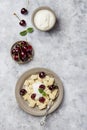 Cottage cheese dumplings with sour cream and cherries Royalty Free Stock Photo