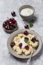 Cottage cheese dumplings with sour cream and cherries Royalty Free Stock Photo