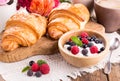 Cottage cheese with fresh berries, cup of coffee and croissants Royalty Free Stock Photo