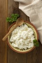 Cottage cheese isoalted on wooden background. Dairy products, calcium and protein. Healthy breakfast Royalty Free Stock Photo