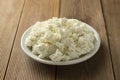 Cottage cheese isoalted on wooden background. Dairy products, calcium and protein. Healthy breakfast Royalty Free Stock Photo