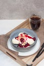 Cottage cheese pancakes with cherry sauce and nuts in grey bowl. Close up. Healthy breakfast concept Royalty Free Stock Photo