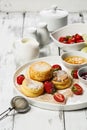 Cottage Cheese Pancakes with fresh strawberries and jam. Curd Cheese Pancakes on a white plate sprinkled with powdered sugar Royalty Free Stock Photo