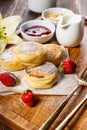 Cottage Cheese Pancakes with fresh strawberries and jam. Curd Cheese Pancakes on a wooden board sprinkled with powdered sugar Royalty Free Stock Photo