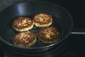 The cottage cheese pancakes fried in pan Royalty Free Stock Photo
