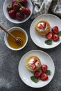 Cottage cheese pancakes, ricotta fritters on ceramic plate with  fresh strawberry Royalty Free Stock Photo