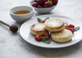 Cottage cheese pancakes, ricotta fritters on ceramic plate with  fresh strawberry Royalty Free Stock Photo