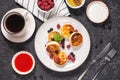 Cottage cheese pancakes, ricotta fritters or syrniki with currant and strawberries. Healthy and delicious breakfast Royalty Free Stock Photo