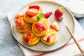 Cottage cheese pancakes, ricotta fritters or syrniki with mint and strawberries. Healthy and delicious morning breakfast Royalty Free Stock Photo