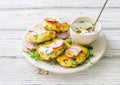 Cottage cheese pancakes with spinach on white plate close up