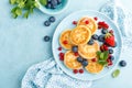 Cottage cheese pancakes, syrniki with fresh berries for breakfast Royalty Free Stock Photo