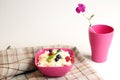 Cottage cheese in pink plastic bowl decorated mint and berry. Royalty Free Stock Photo