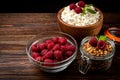 Cottage cheese, raspberry jam and fresh raspberry on dark wooden background Royalty Free Stock Photo