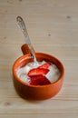 Cottage cheese with strawberries in a ceramic bowl