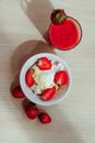 cottage cheese with strawberries in a white bowl and strawberry juice next. Top view.  Flat lay. Royalty Free Stock Photo