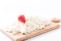 Cottage cheese with strawberries on a wooden board