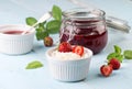 Cottage cheese and strawberry jam in a jar on wooden background Royalty Free Stock Photo