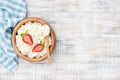 Cottage cheese, tvorog or curd in wooden bowl