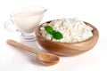 Cottage cheese in a wooden bowl isolated on a white background Royalty Free Stock Photo