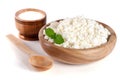 Cottage cheese in a wooden bowl isolated on a white background Royalty Free Stock Photo