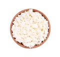 Cottage cheese in a wooden bowl isolated on a white background. Top view. Royalty Free Stock Photo