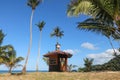 Cottage on the coconut beach. The clock tower or lifeguard tower , Hut against the blue sky Royalty Free Stock Photo