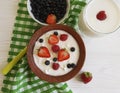 Cottage dairy cheese, yoghurt, strawberry,fruit morning lunch blueberries healthy traditional eating a white wooden background Royalty Free Stock Photo