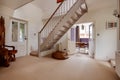 Cottage entrance hall with stairs Royalty Free Stock Photo