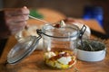 Cottage farmer paneer cheese, sun dried tomatoes and rosemary marinated in olive oil in glass jar Royalty Free Stock Photo