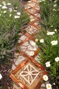 Cottage Garden Path with Bricks and Stone Pavers Surrounded by Daisies and Catmint Flowers