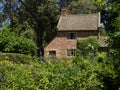 Cottage garden of small brick home Royalty Free Stock Photo