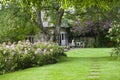 Flowering Cottage Garden and patio on hot summer d Royalty Free Stock Photo