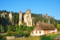 Cottage house with forest and sandstone towers