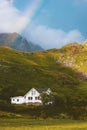 Cottage house in mountains and rainbow landscape traditional scandinavian village