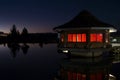 Cottage illuminated at night