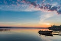 Cottage Lake Sunrise with Boat at Dock in Kawartha Lakes Ontario Canada Royalty Free Stock Photo