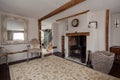 Cottage living room with fireplace and mirror