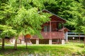 Cottage of the log. House of extruded wooden profile.